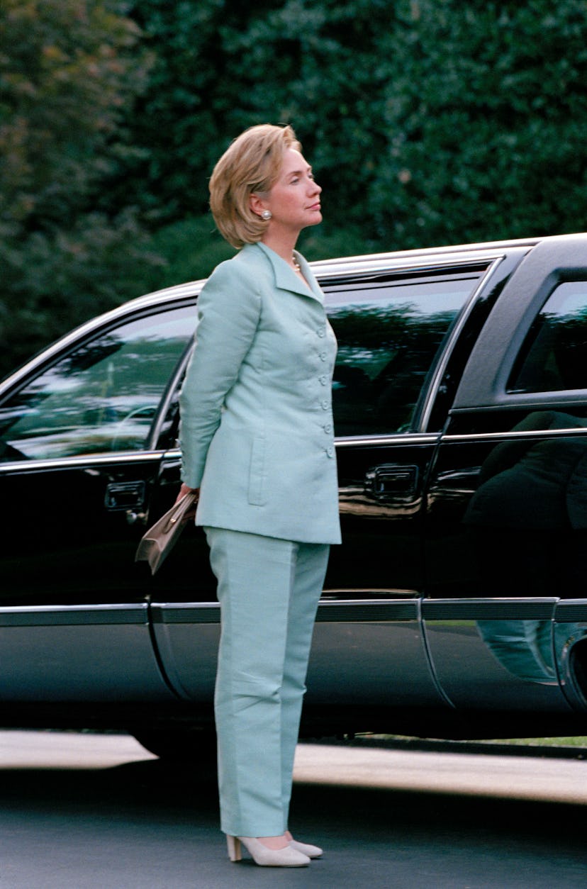 First Lady Hillary Clinton waits to depart with husband U.S President Bill Clinton after a Democrati...