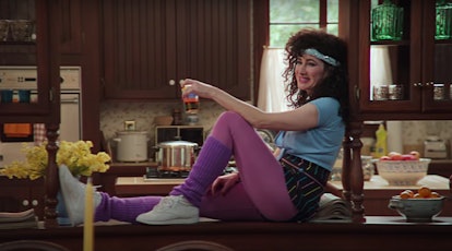 Agnes sits on the kitchen counter in '80s jazzercise clothes in 'WandaVision.'