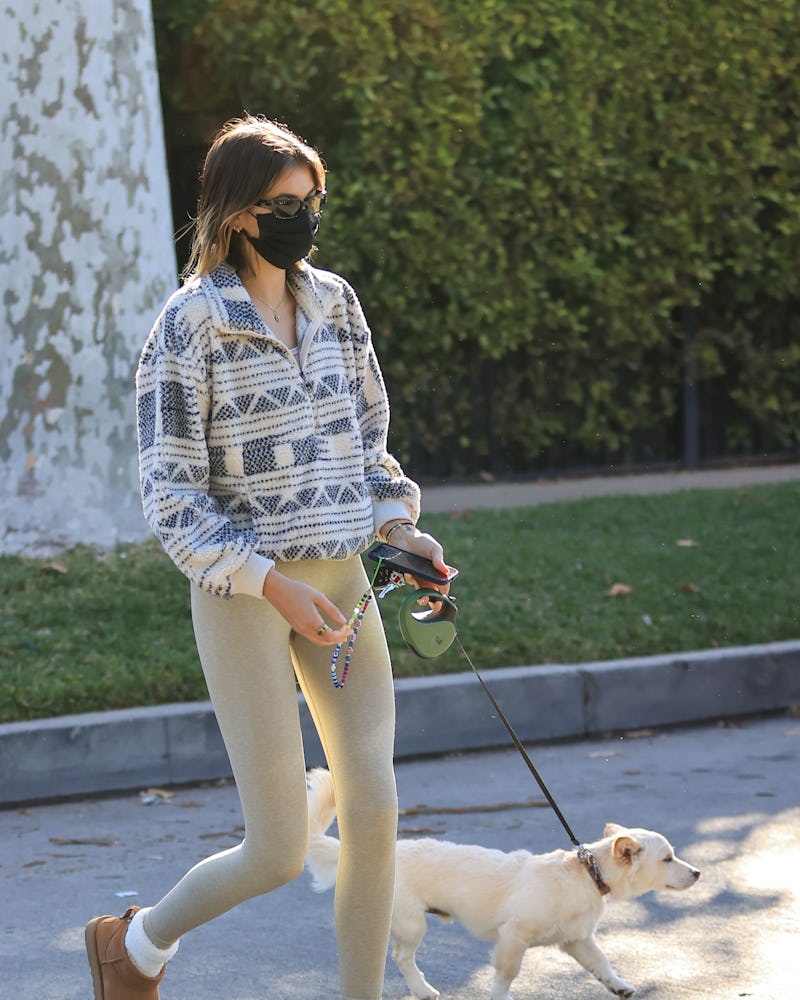 Kaia Gerber takes her dog for a walk on February 2, 2021 in Los Angeles, California. 