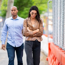 Kendall Jenner wears Nili Lotan brown snake print jacket.