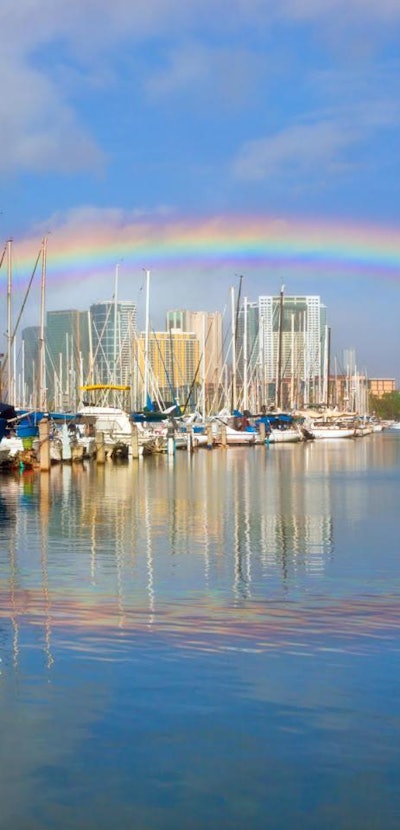 Rainbow over Honolulu Harbor with what appears to be its reflection. However, the reflected bow is n...