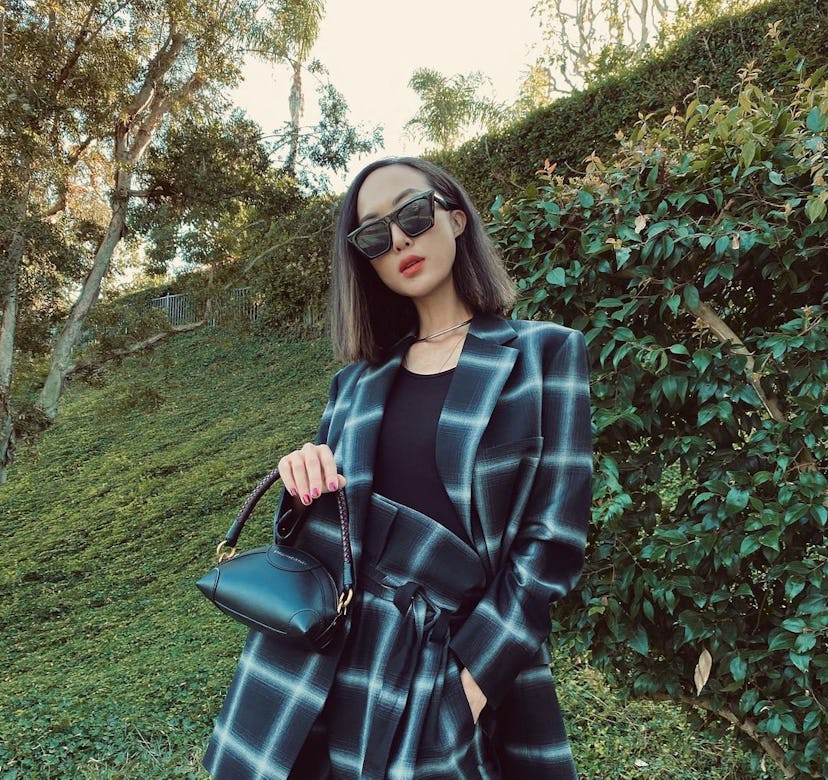 A photo of Chriselle Lim in a graphic suit.