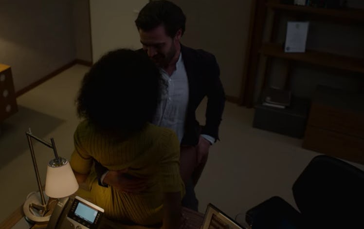 Tom Bateman as David Ferguson and Simona Brown as Louise Barnsley hooking up on a desk in Episode 3 ...