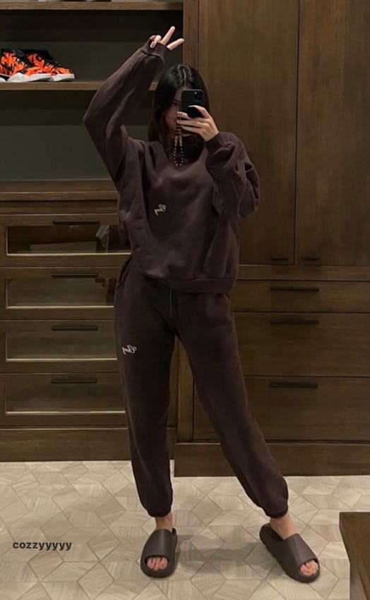 Kendall Jenner in an all-brown sweatsuit.