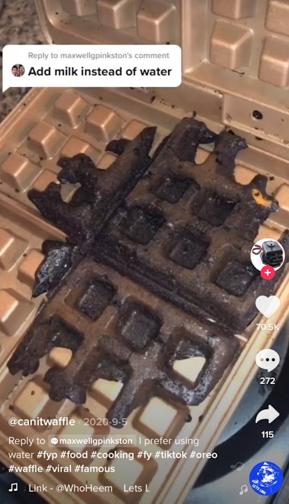 An Oreo waffle cooks in a waffle maker. 