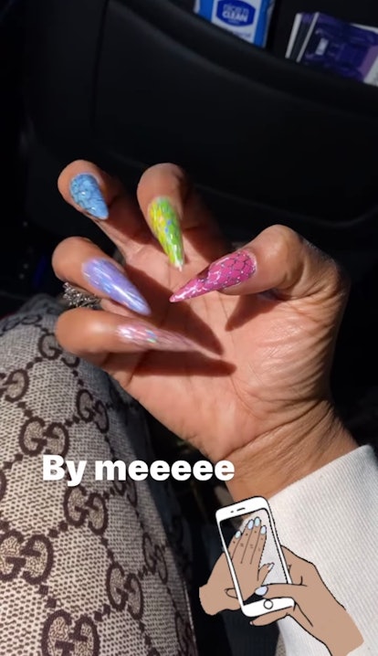A close-up of Taraji P. Henson's hand with the rainbow nail look she created herself
