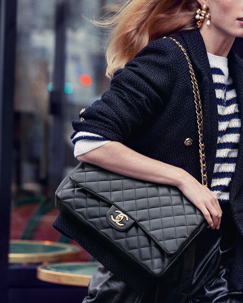 women carrying chanel bag