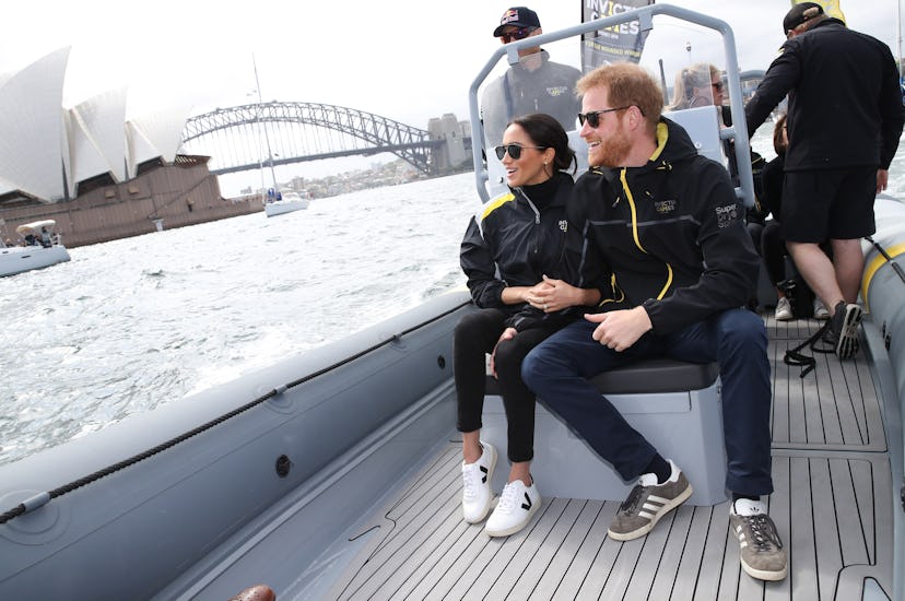 Prince Harry, Duke of Sussex and Meghan, Duchess of Sussex on Sydney Harbour looking out at Sydney O...