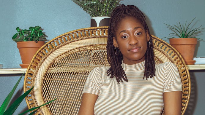 Naj Austin sitting down, looking serious, ready to talk about police brutality towards people of col...