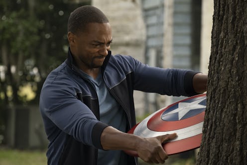 Sam Wilson with the Captain America shield on 'Falcon and the Winter Soldier' via the Disney+ press ...