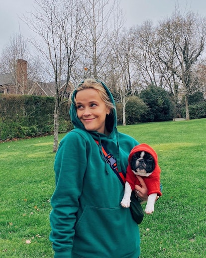 Reese Witherspoon and her dog pose in a photo from Instagram.