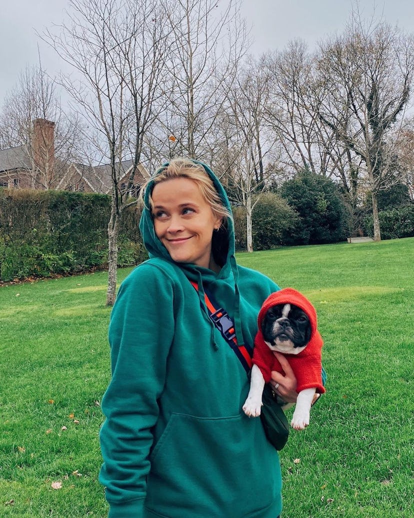 Reese Witherspoon and her dog pose in a photo from Instagram.