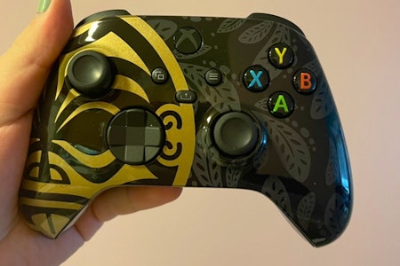 A close up of the branded controller.