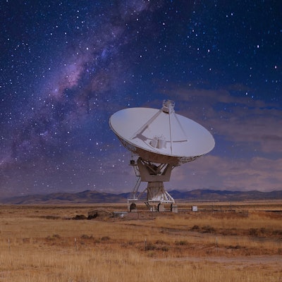 The Very Large Array telescope with a starry background