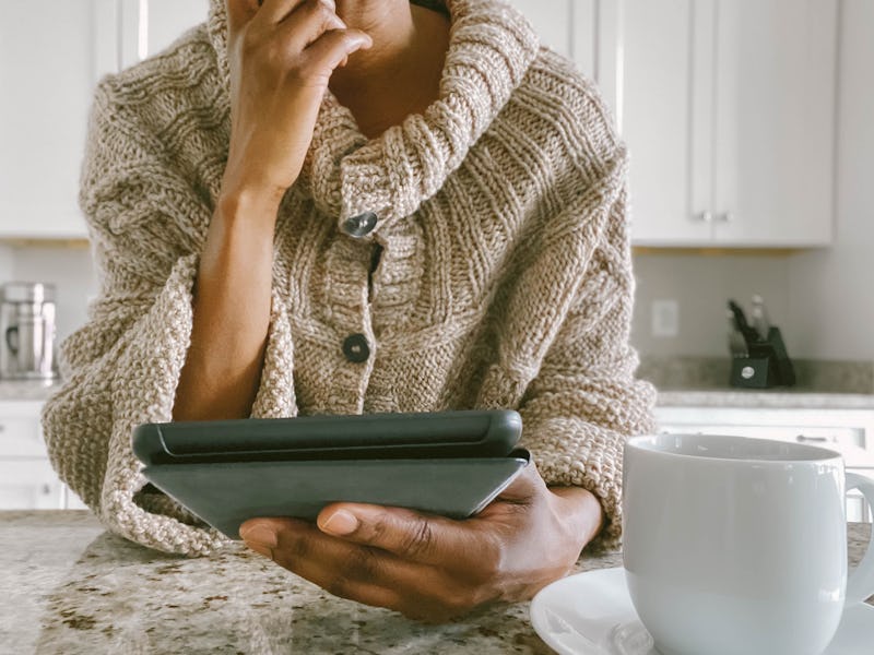 Woman anxiously looking at computer