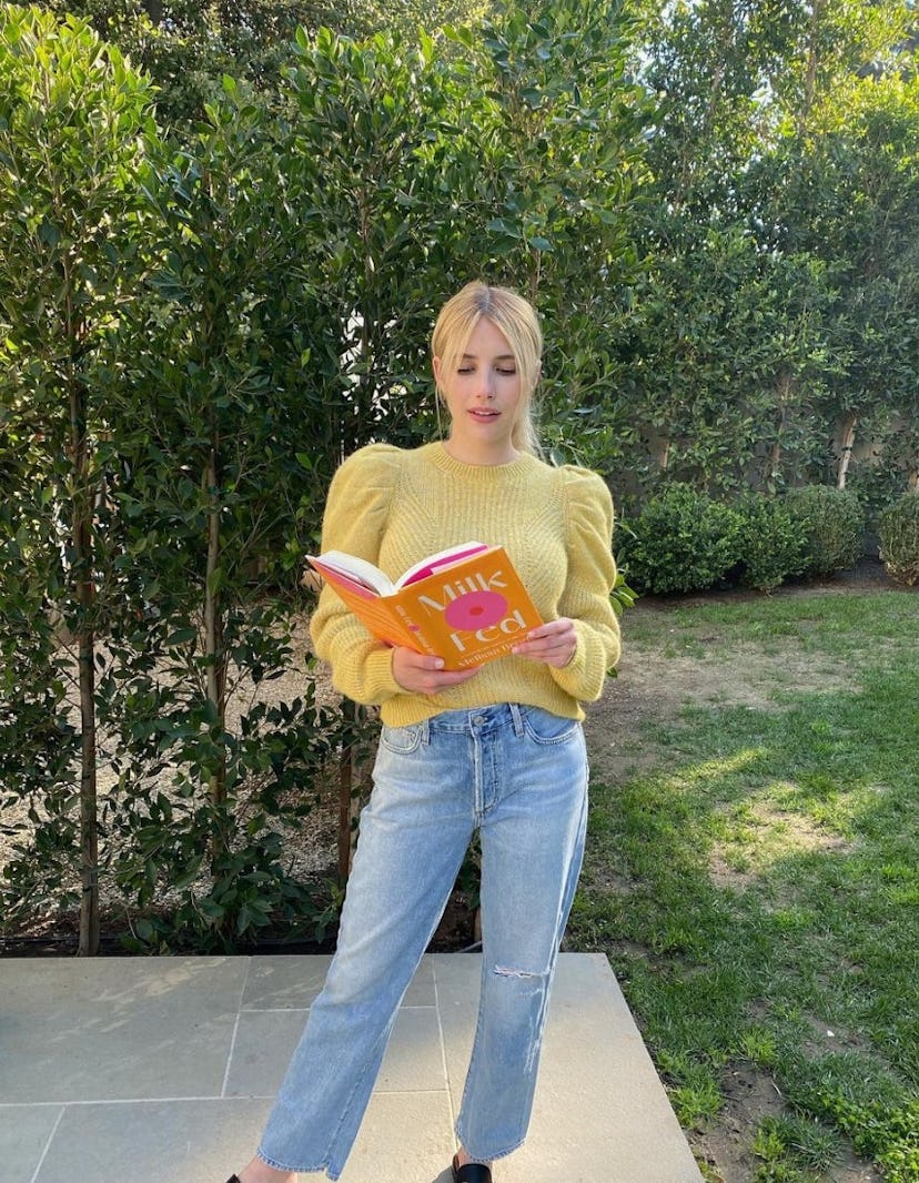 Emma Roberts reading a book. 