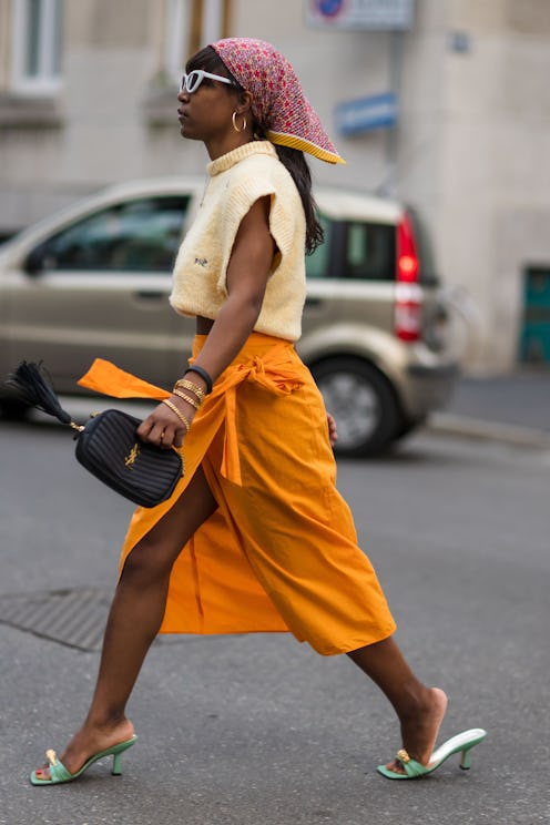 Photo of a woman walking in Milan during Fashion Week 2021.