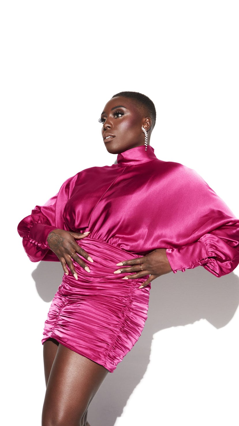 A portrait of Laura Mvula in a pink satin dress.