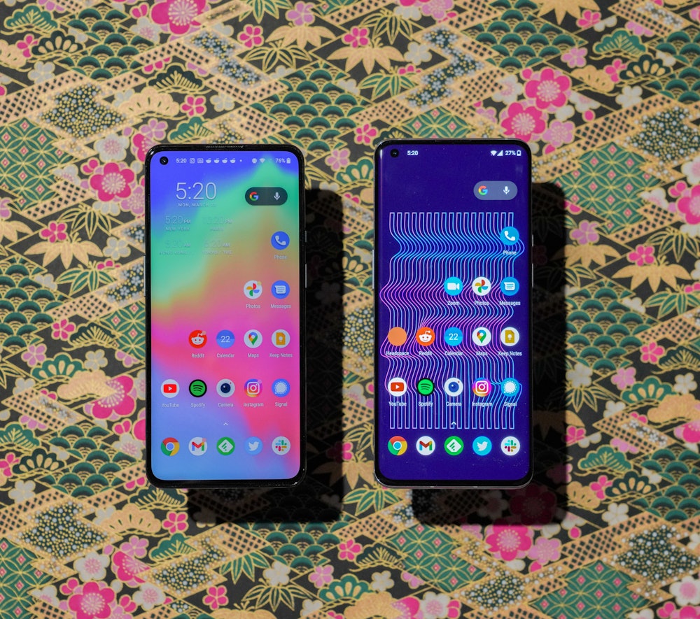 The OnePlus 9 (left) has a flat display compared to the OnePlus 9 Pro (right) which has a curved scr...