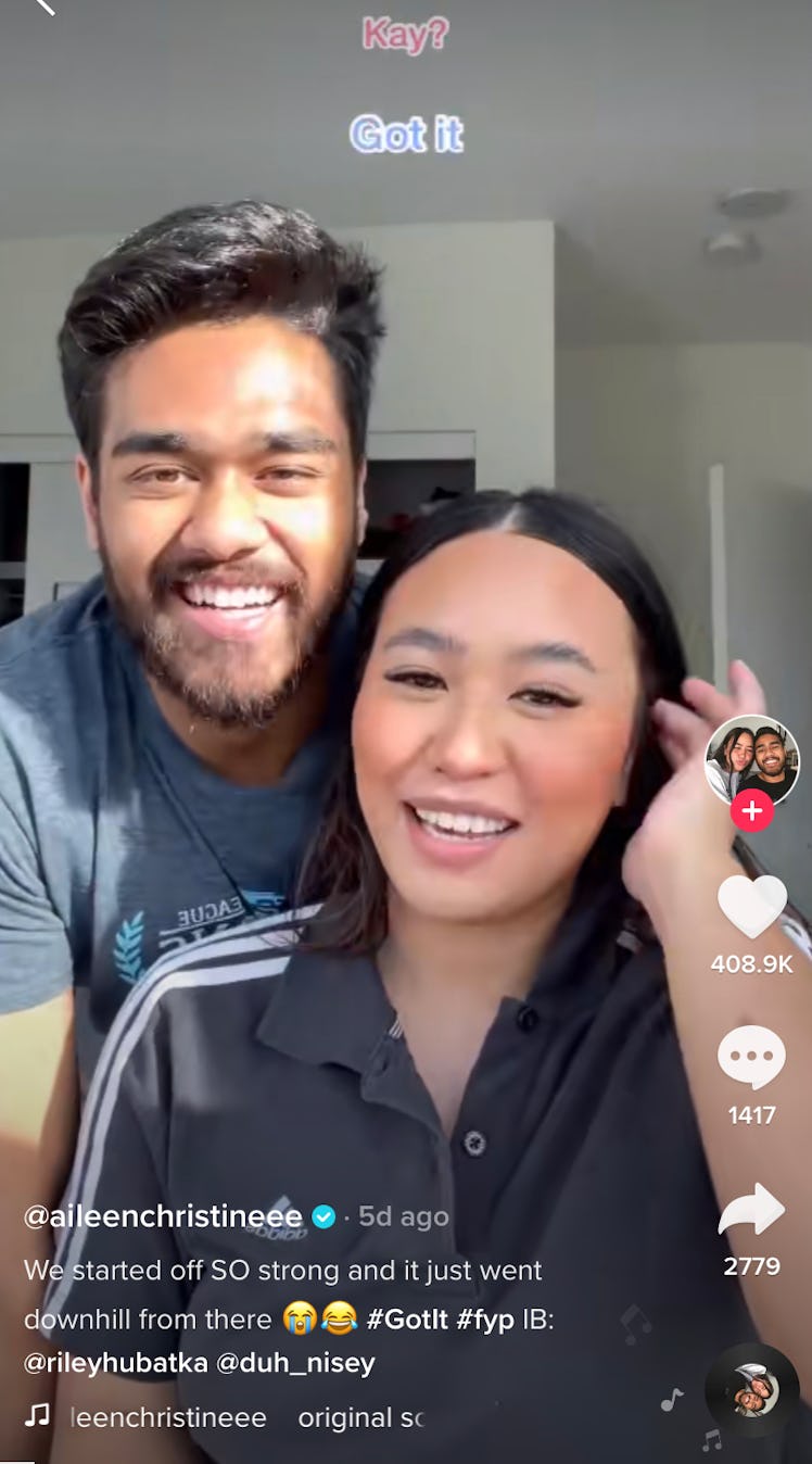 A happy couple plays the "Got It" game on TikTok together. 