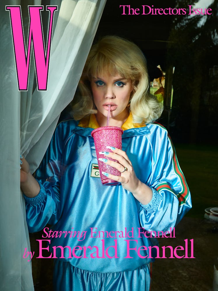 Emerald Fennell wears a Gucci sweatshirt and pants; Theo Fennell rings. TheBlingBabyy custom cup.