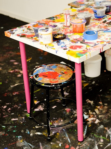 A worktable with paint cans in Quarles’s studio.