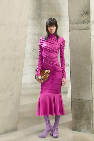 Model in pink turtleneck dress