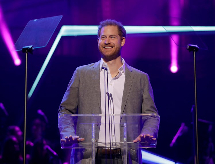 Prince Harry standing at a podium