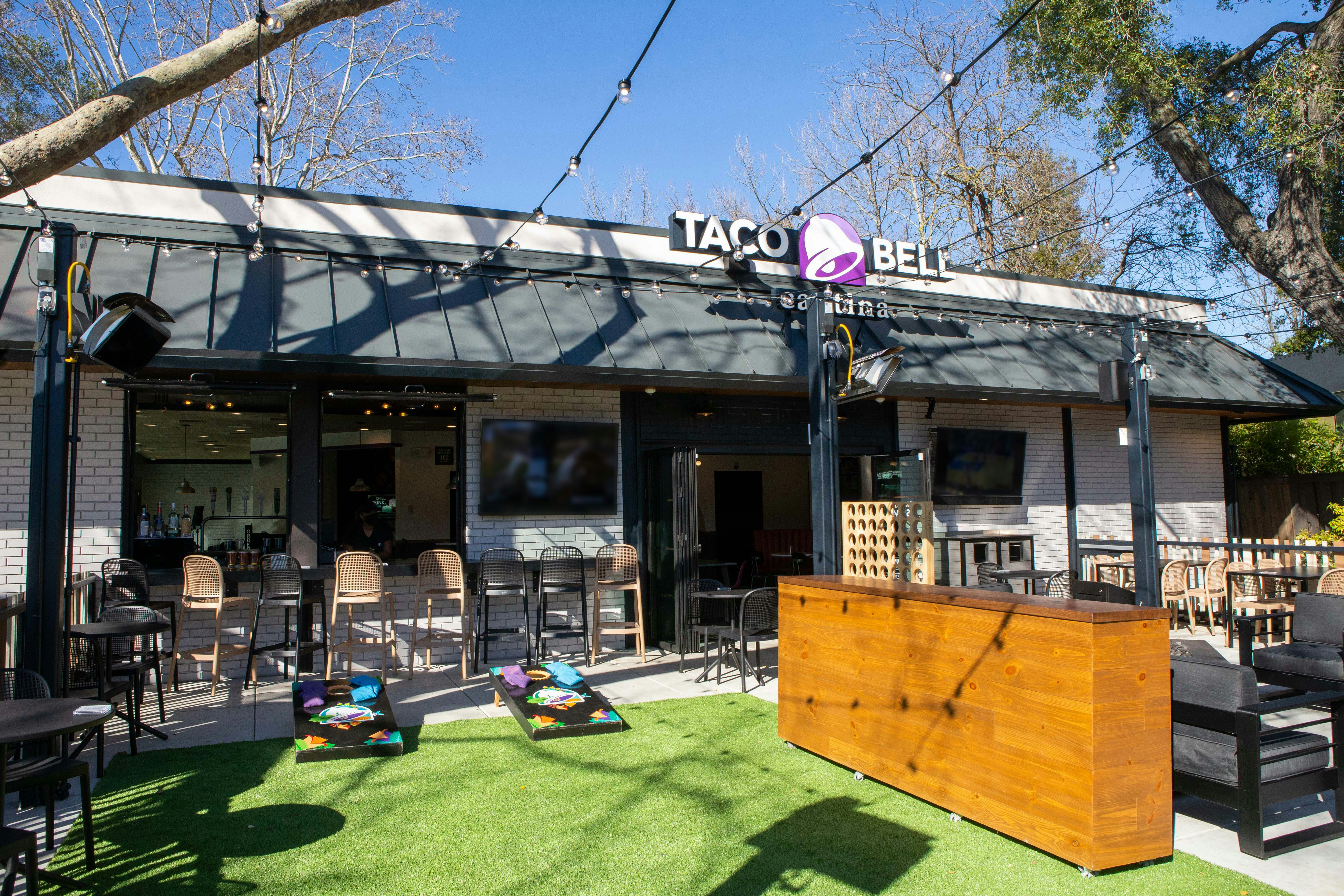 Taco Bell's drive-thru Cantina with a fire pit and cornhole is the first of its kind. 