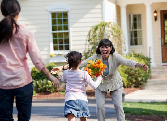 child running to his grandmother