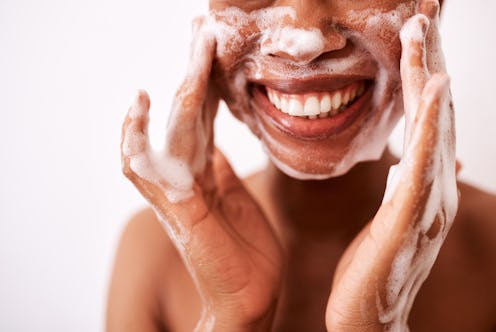 woman washing her face