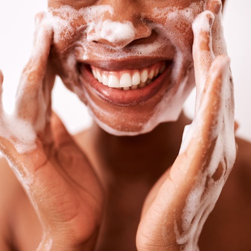 woman washing her face