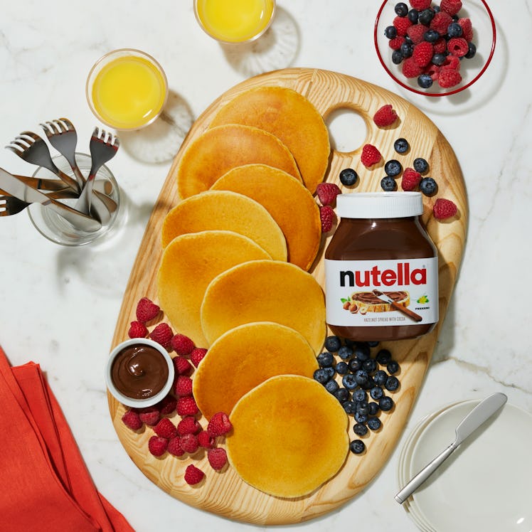 A pancake board is decorating with fruit and Nutella, in support of Nutella and Williams Sonoma's vi...