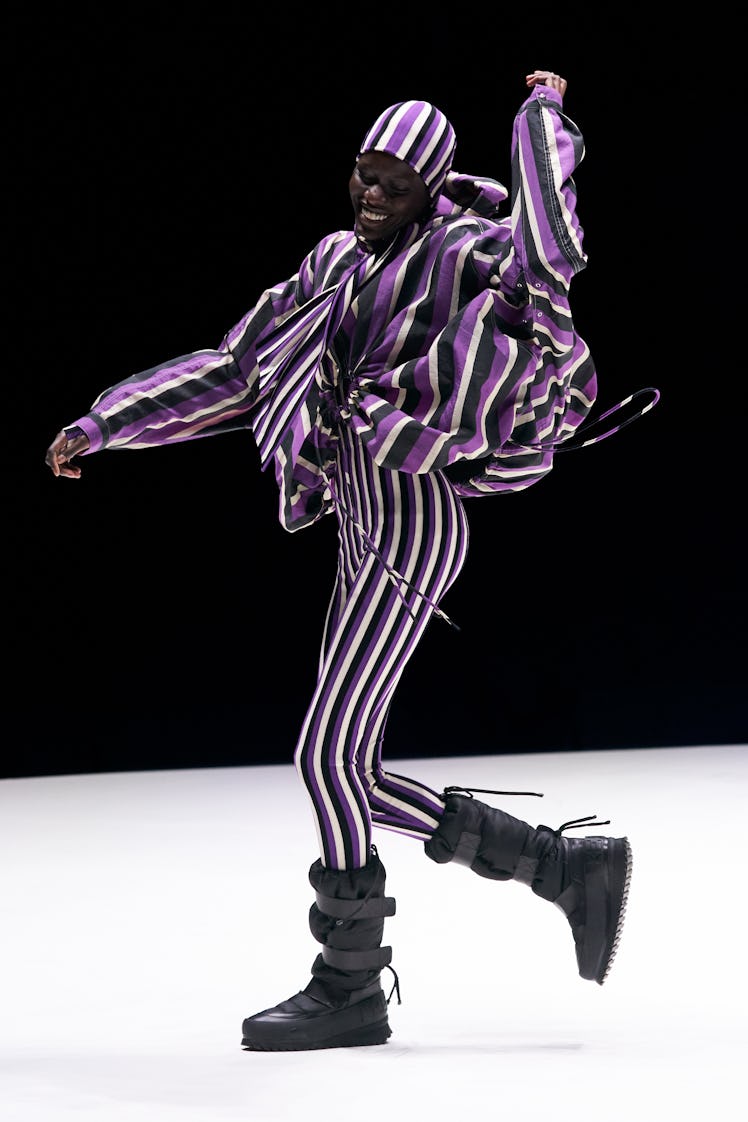 A model in a striped Kenzo outfit 