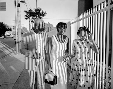 Julius Tennon, Viola Davis, and their daughter Genesis Tennon walking down a street