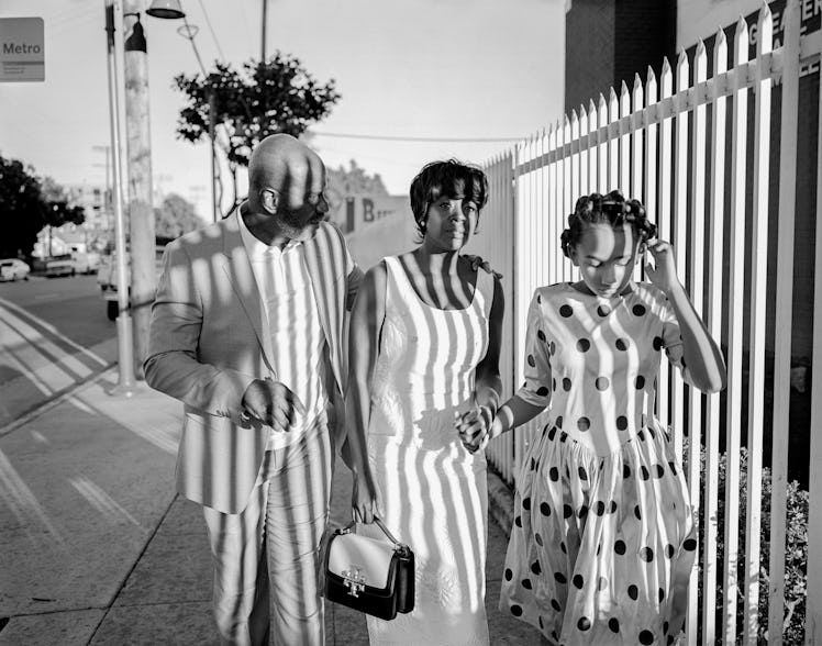 Julius Tennon, Viola Davis, and their daughter Genesis Tennon walking down a street