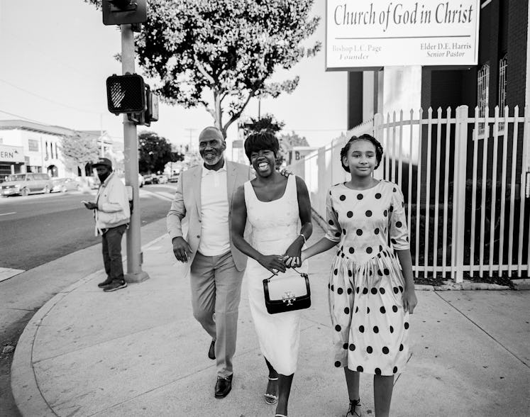 Julius Tennon, Viola Davis, and their daughter Genesis Tennon walking down a street and smiling