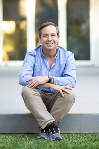 a businessman sitting on a stoop