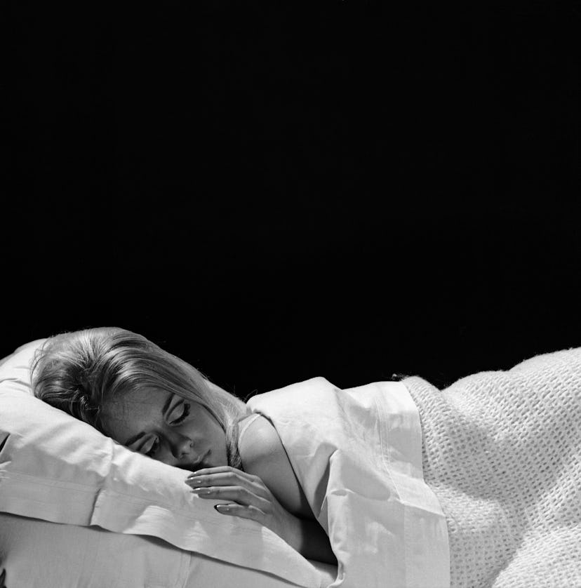 A woman sleeping after applying La Mer Night Balm