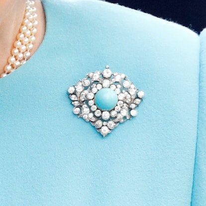 Get to know the stories behind Queen Elizabeth's most memorable brooches, from her palm leaf brooch to her true lover's knot brooch. 