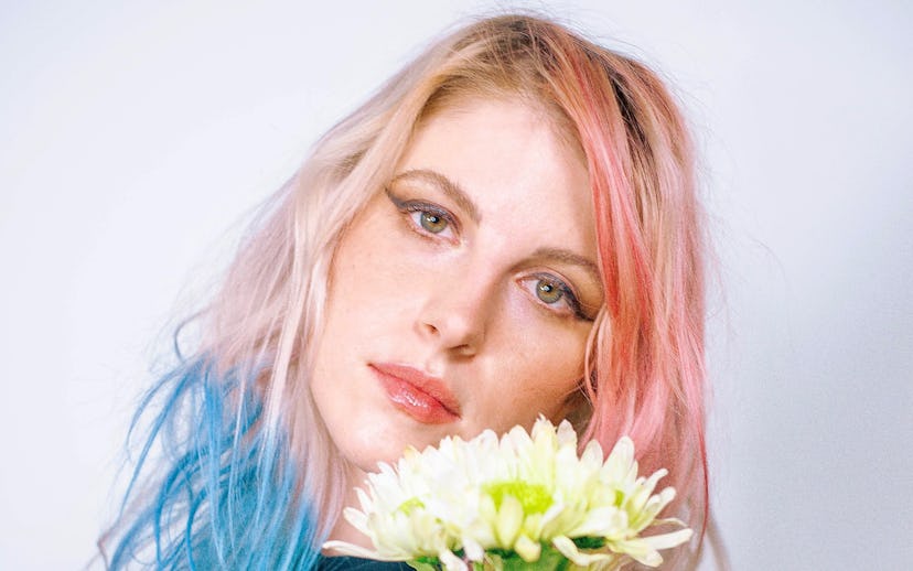 Hayley Williams, co-owner of Good Dye Young, poses with blonde hair that's dyed both pink and blue i...