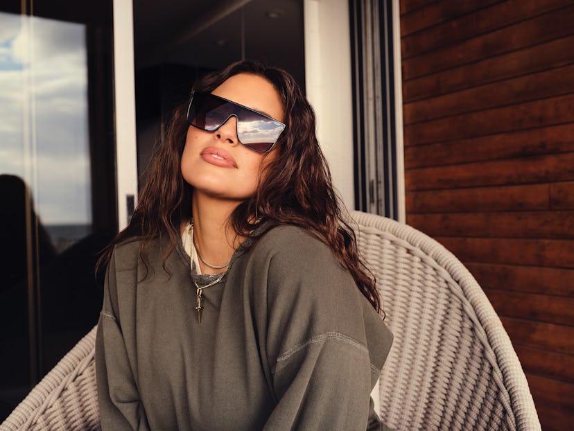Ashley Graham wears a pair of sunglasses from the Ashley Graham x Quay collaboration.