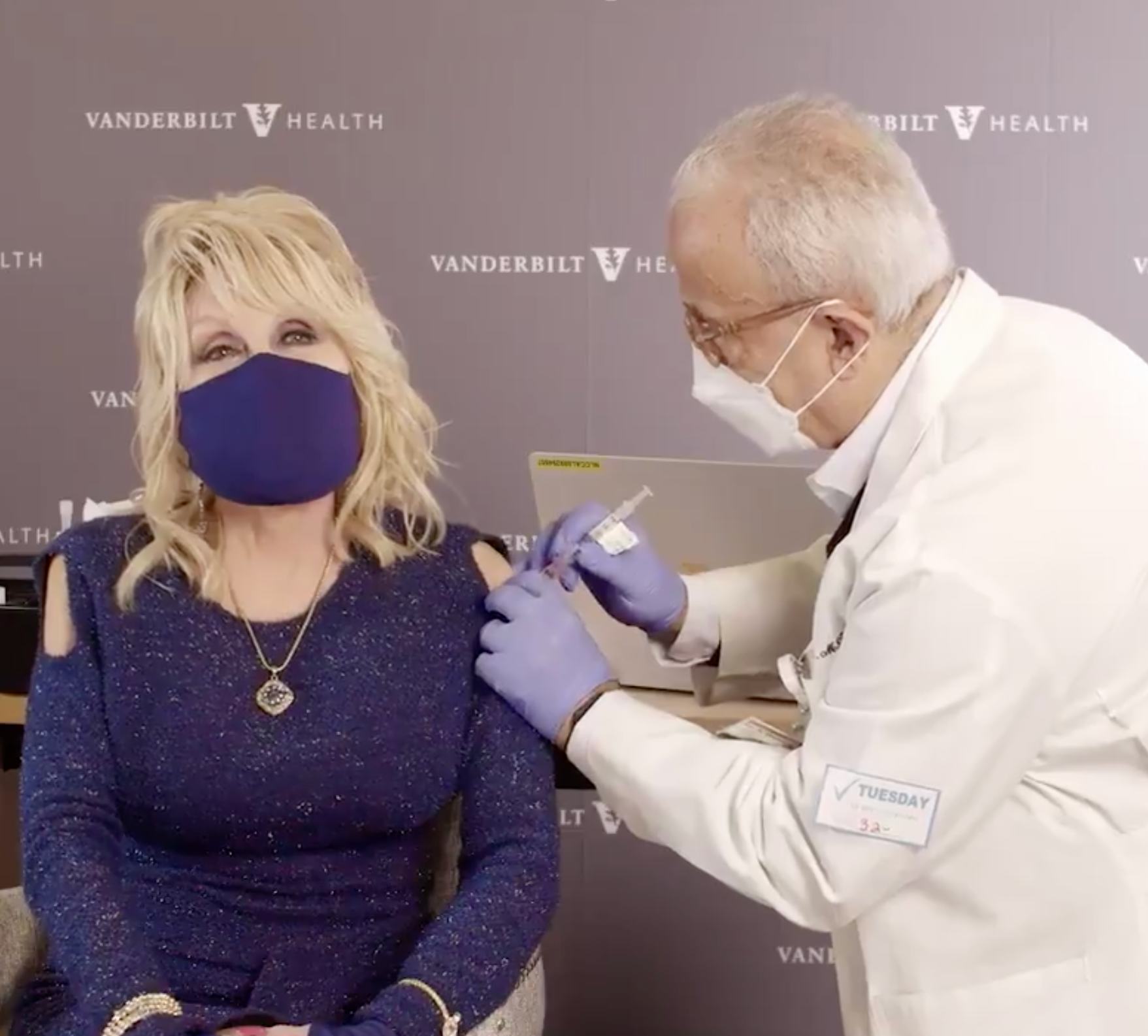 Dolly Parton receives her moderna coronavirus vaccination from a doctor 