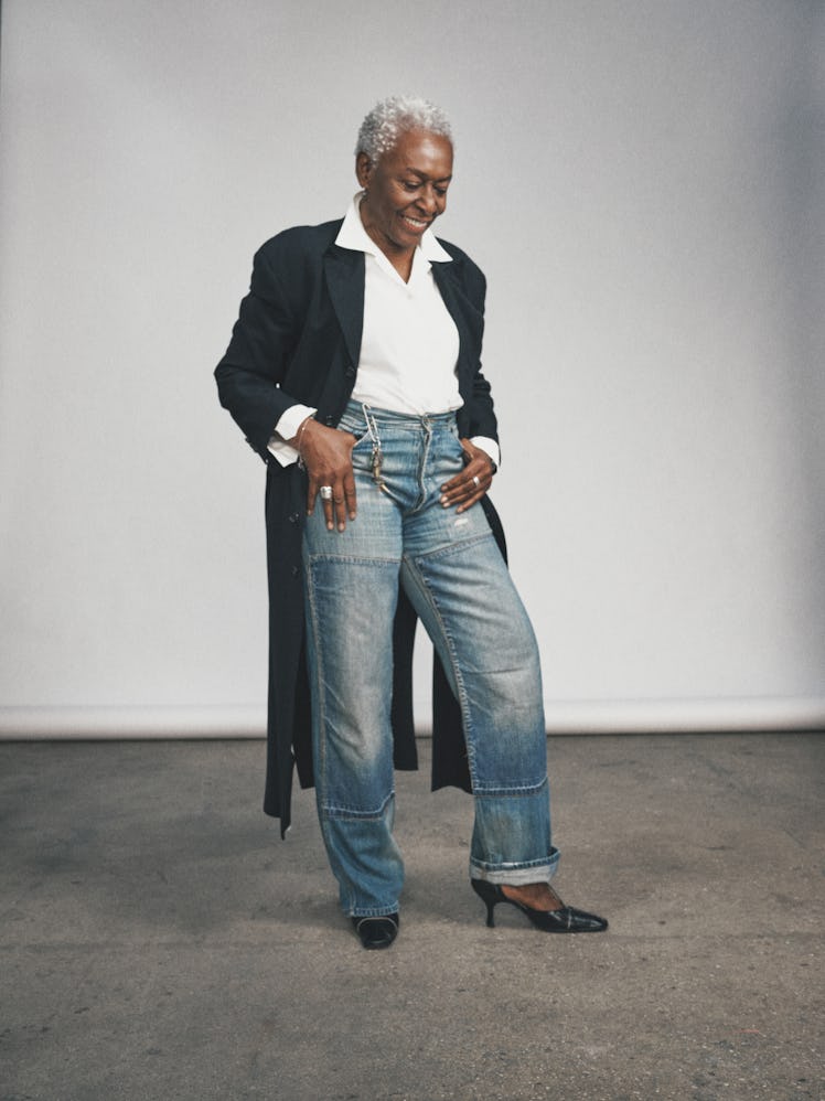 Bethann Hardison posing in oversized pants, a white shirt, and in a black blazer