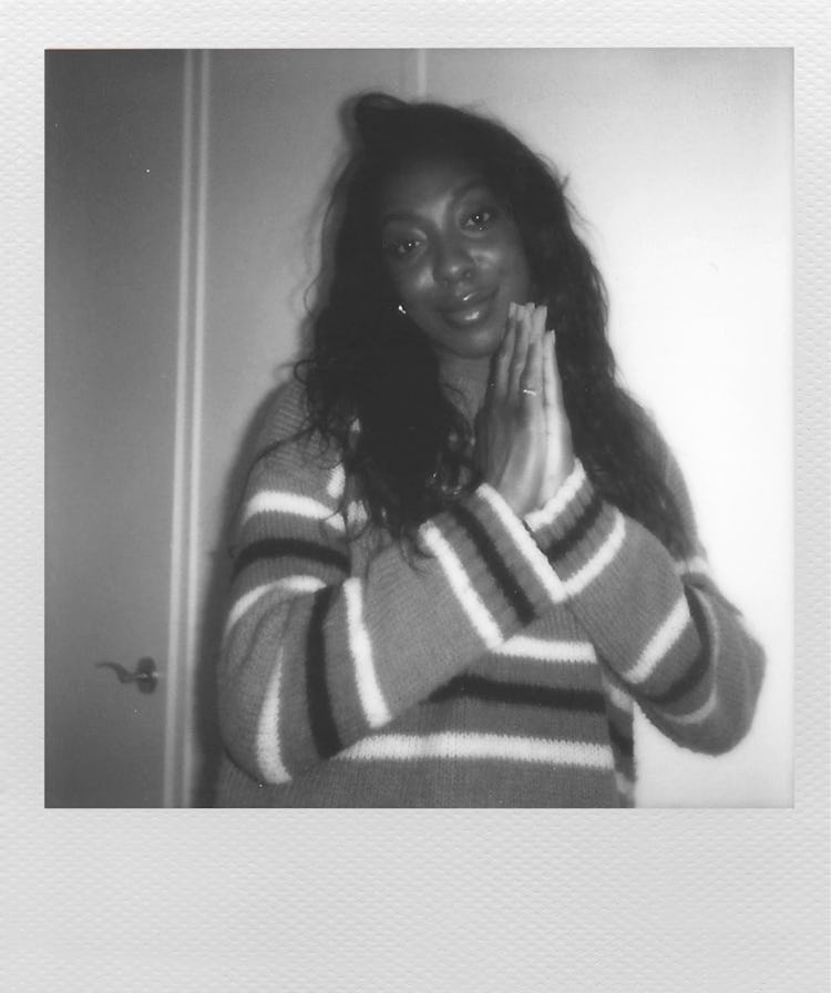 Actress Ego Nwodim wearing a striped sweater in a black and white picture