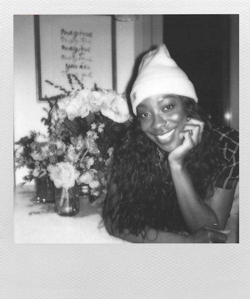 Actress Ego Nwodim, a cast member of Saturday Night Live, wearing a beanie with flowers next to her