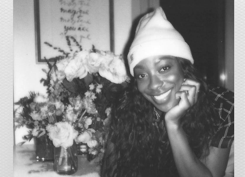 Actress Ego Nwodim, a cast member of Saturday Night Live, wearing a beanie with flowers next to her