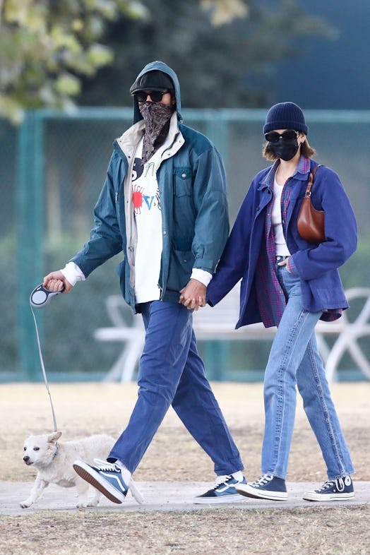 Happy couple Kaia Gerber and Jacob Elordi hold hands as they take Kaia's adorable puppy to a dog par...