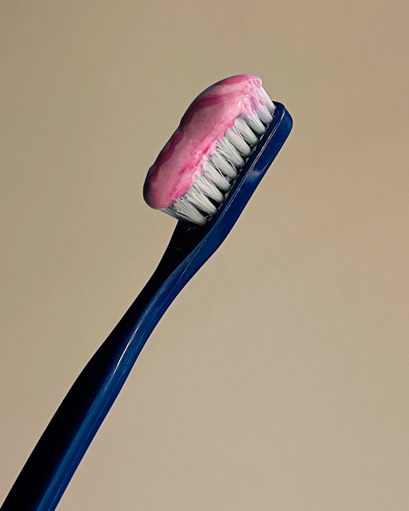 A blue toothbrush with pink toothpaste. Apple partnered with female photographers for an Internation...
