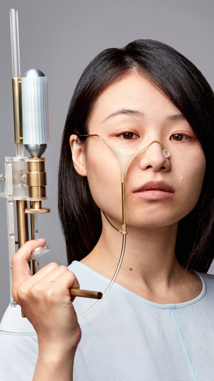 Taiwanese artist Yi-Fei Chen is seen holding a tear gun.